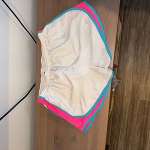 White and neon Nike shorts